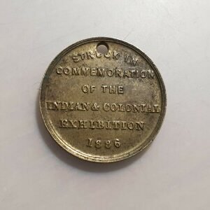 INDIA GRAN BRETAÑA MEDALLA INDIAN & COLONIAL EXPOSITION 1888 LONDRES 20mm AGUJER